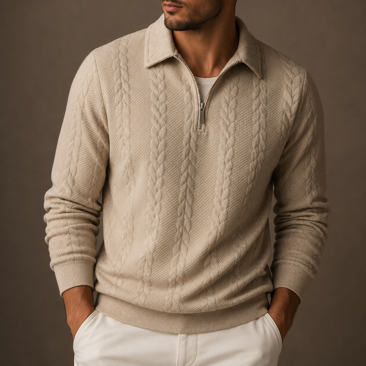Man wearing a beige cable-jacquard quarter-zip sweater