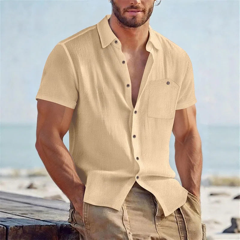 Man wearing a beige linen-blend short-sleeve shirt by the coast