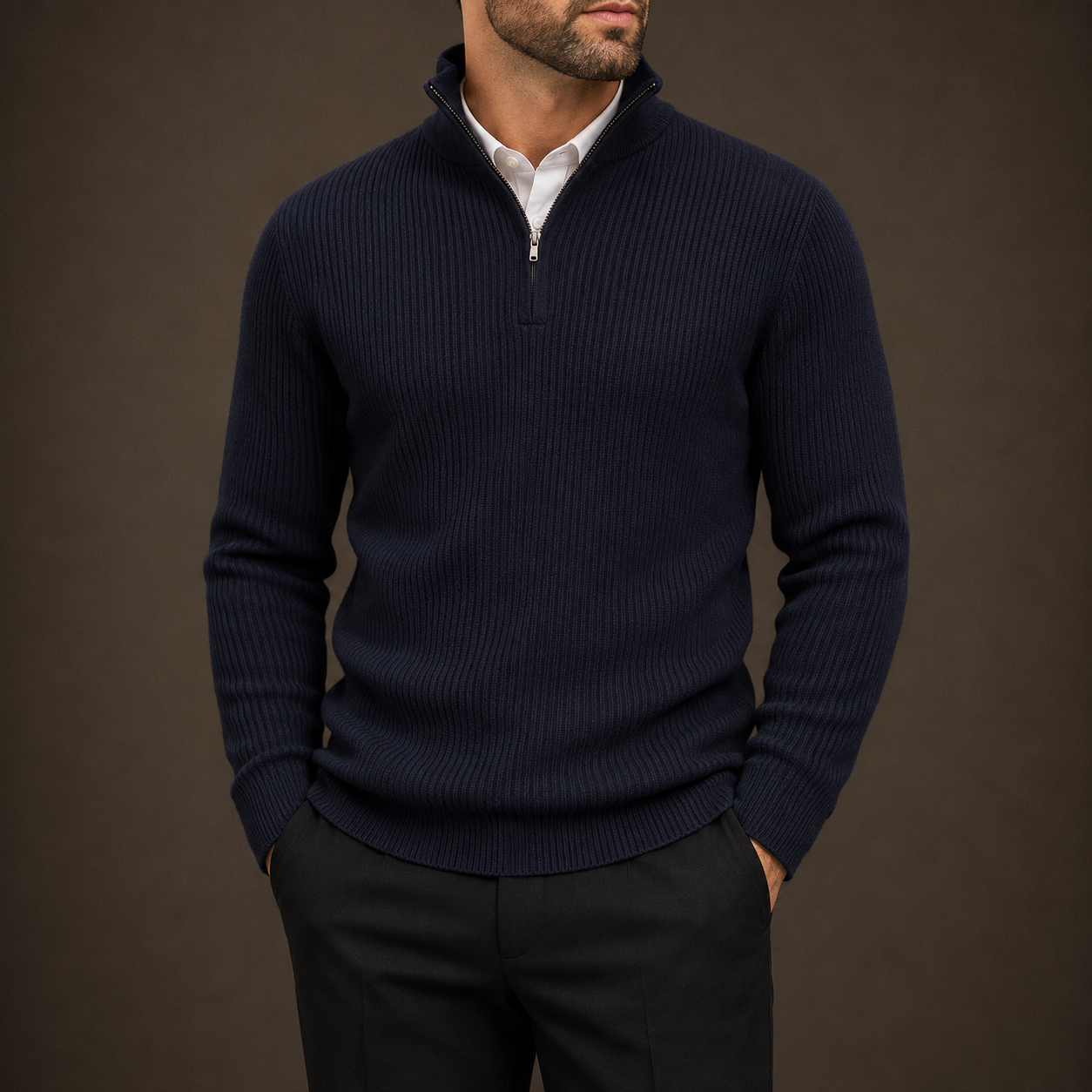 Man wearing a navy ribbed quarter-zip over a white shirt