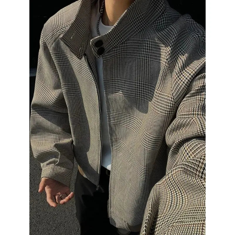 Close-up of the brown houndstooth jacket sleeve and zip front