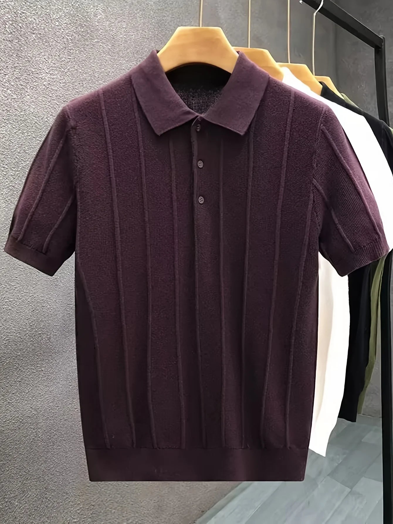Burgundy textured knit polo displayed on a hanger