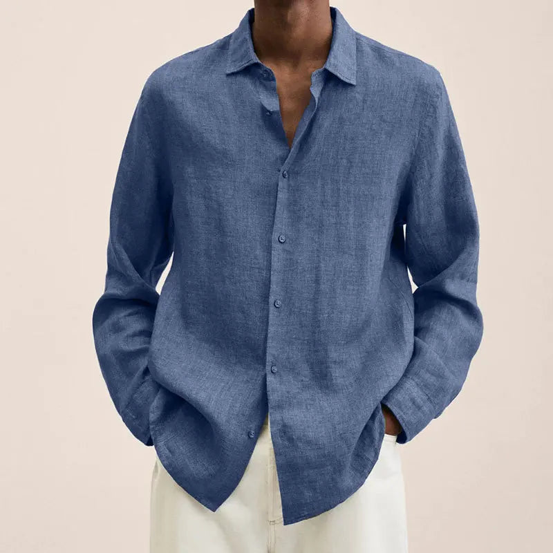 Man wearing a blue relaxed long-sleeve shirt with an open collar