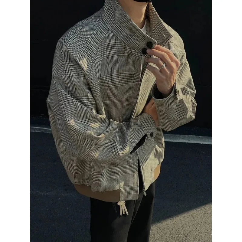 Angled view of the houndstooth stand collar and front pockets