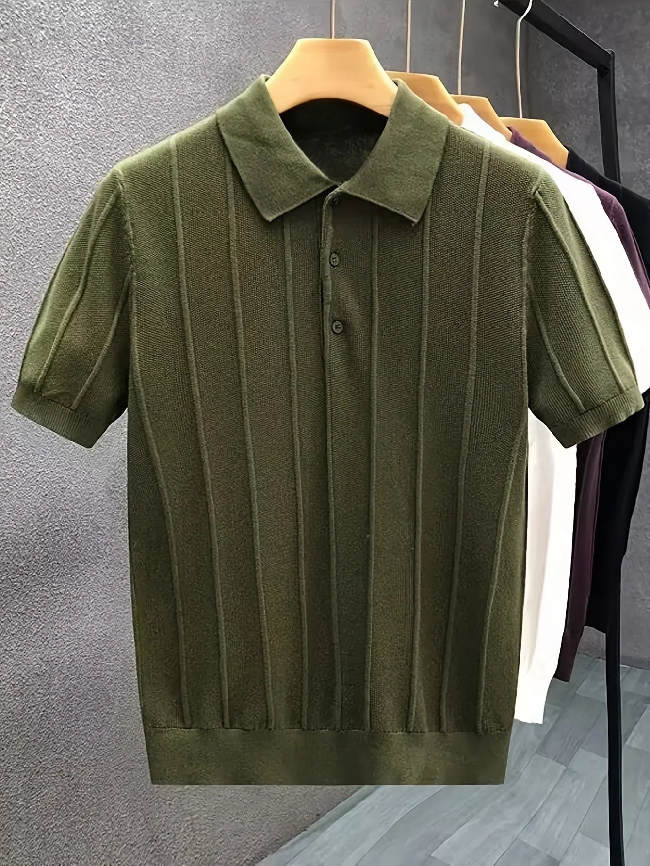 Olive-green textured knit polo displayed on a hanger