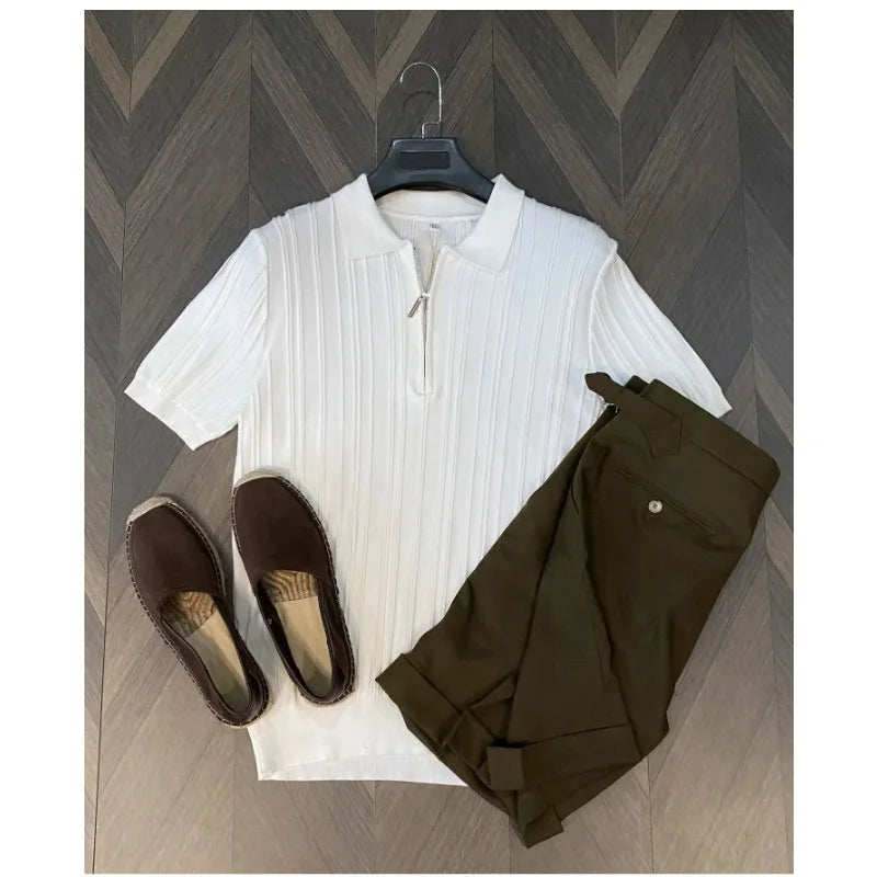 White jacquard zip polo styled with dark green trousers and loafers