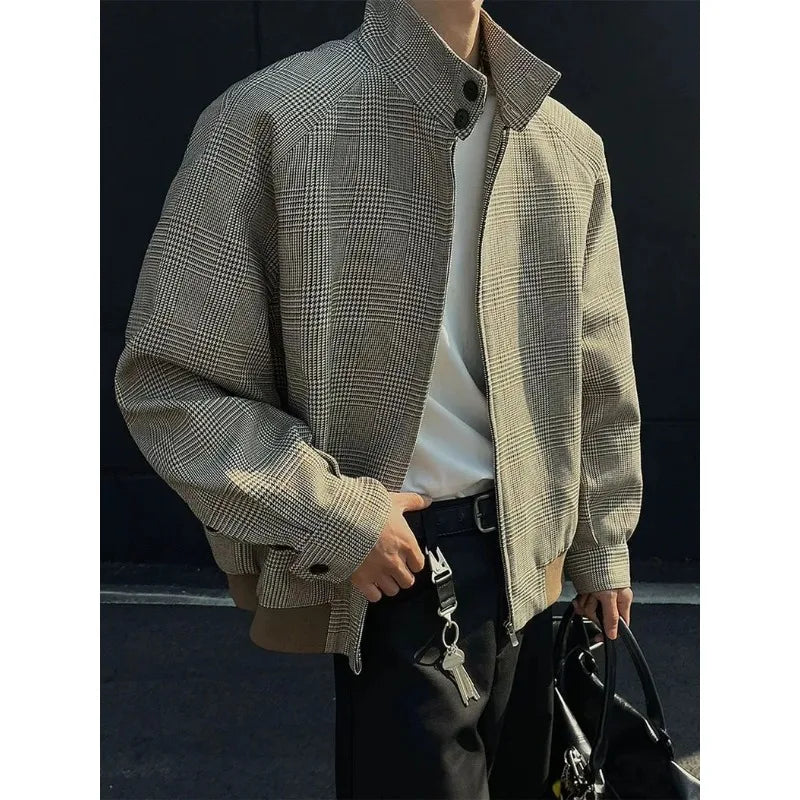 Man wearing a brown houndstooth Harrington jacket with a stand collar