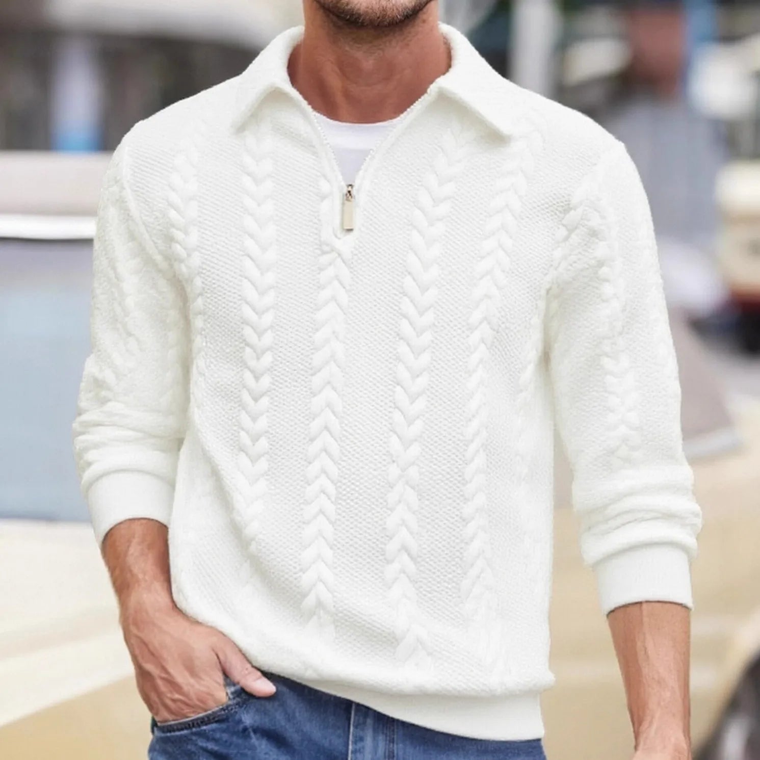 Man wearing a white cable-textured quarter-zip sweater
