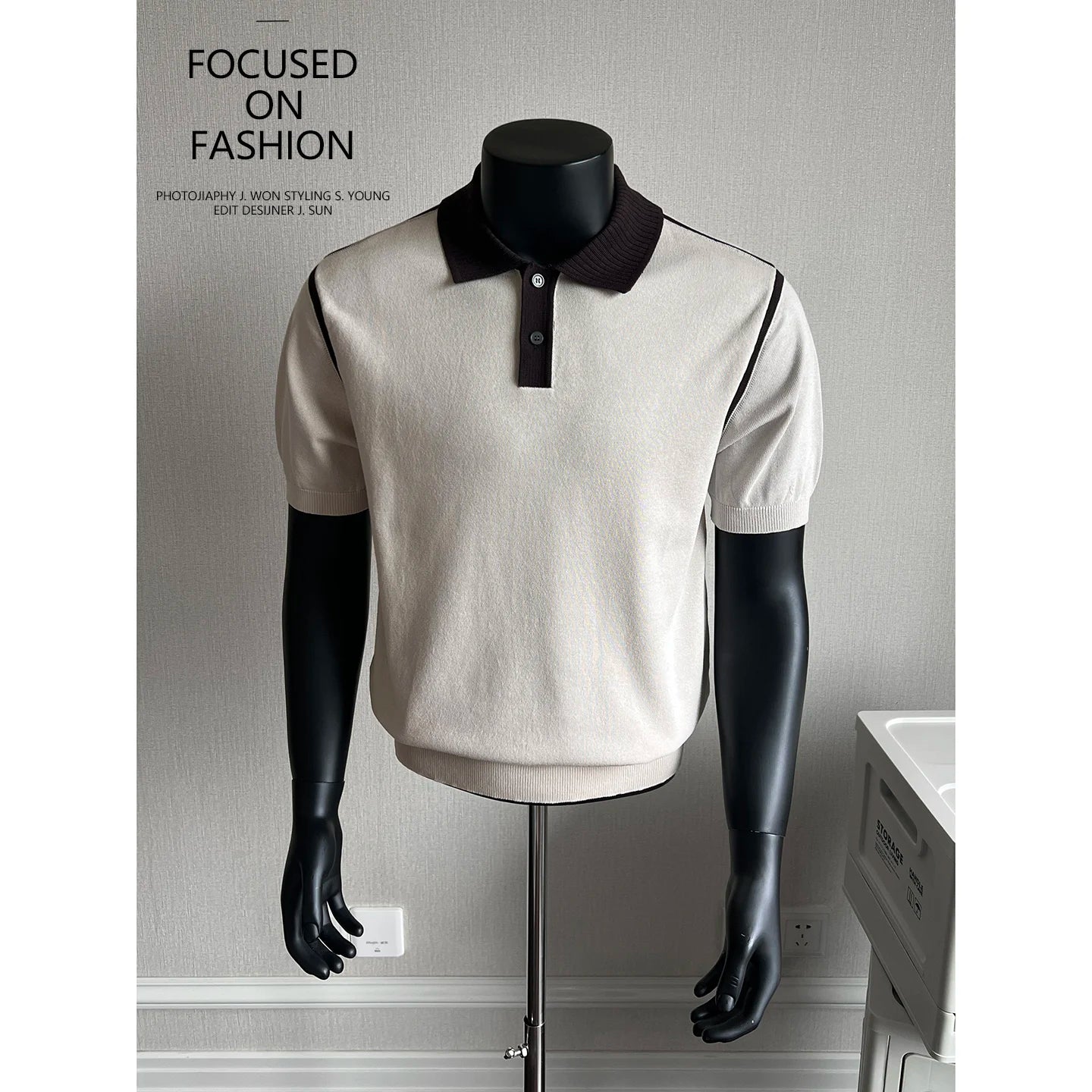 Beige knit polo with black contrast trim on a mannequin