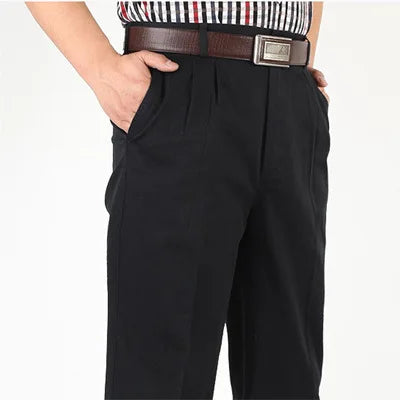 Close-up of black double-pleat trousers at the waist