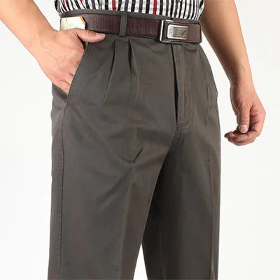Close-up of dark gray double-pleat trousers