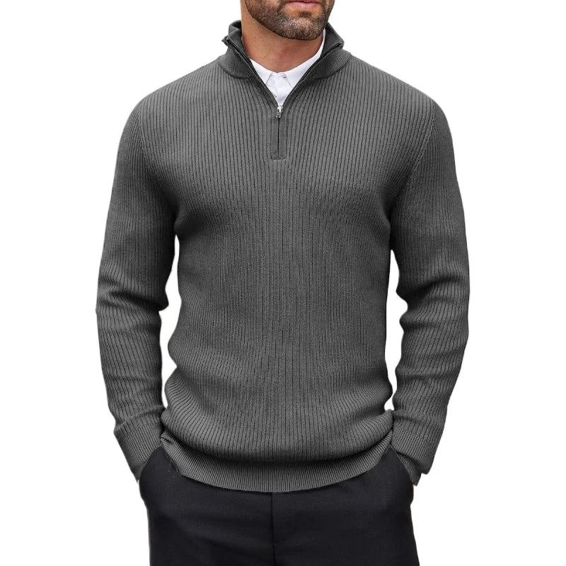 Man wearing a dark-gray quarter-zip sweater with ribbed texture