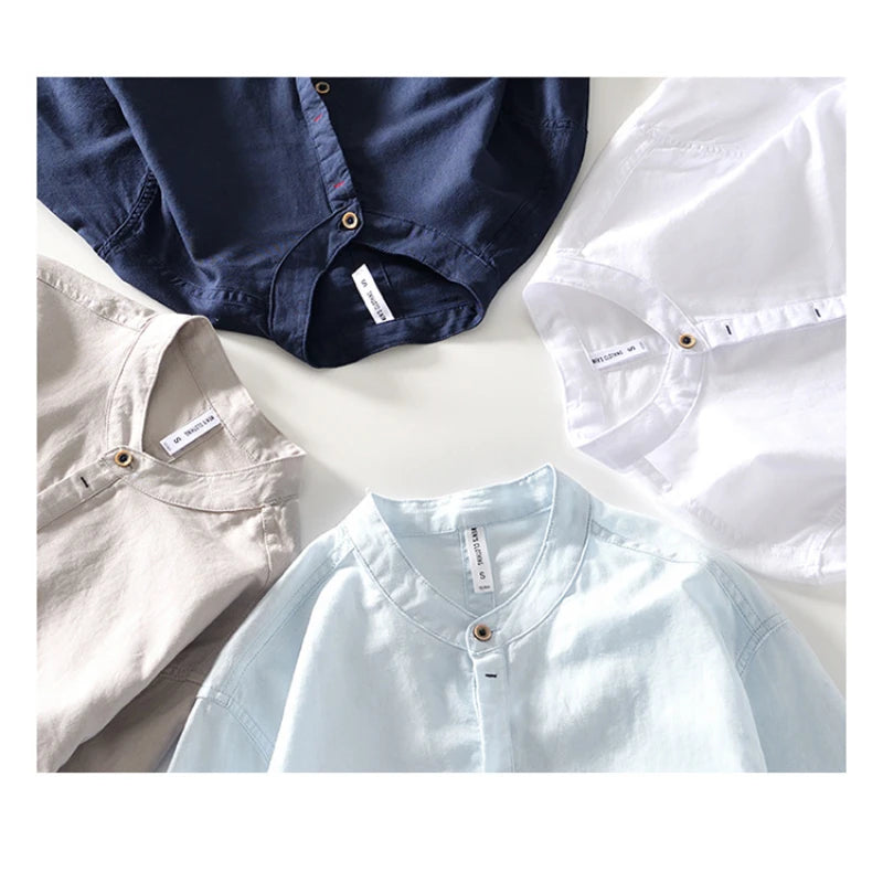 Navy, gray, sky-blue and white Mandarin-collar shirts arranged together