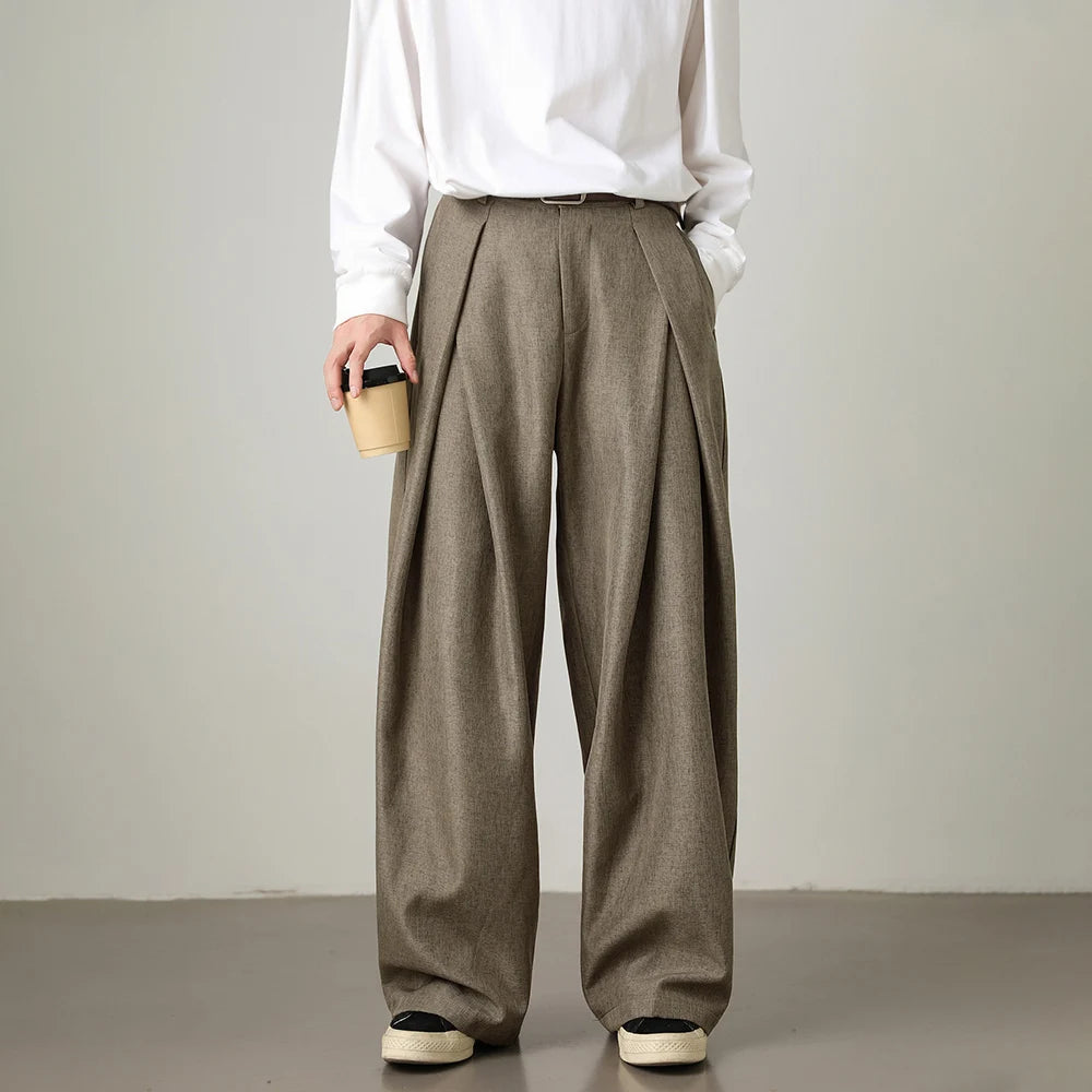 Man wearing brown relaxed wide straight-leg trousers