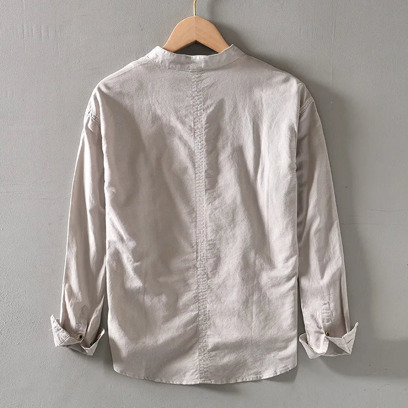 Back view of a gray Mandarin-collar long-sleeve shirt on a hanger