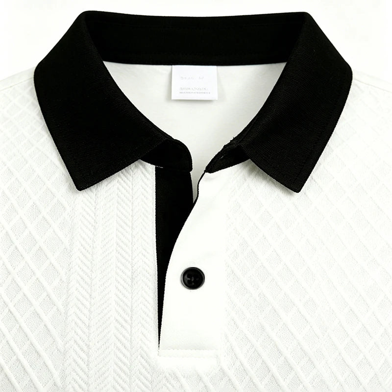 Close-up of white jacquard knit texture and black polo collar