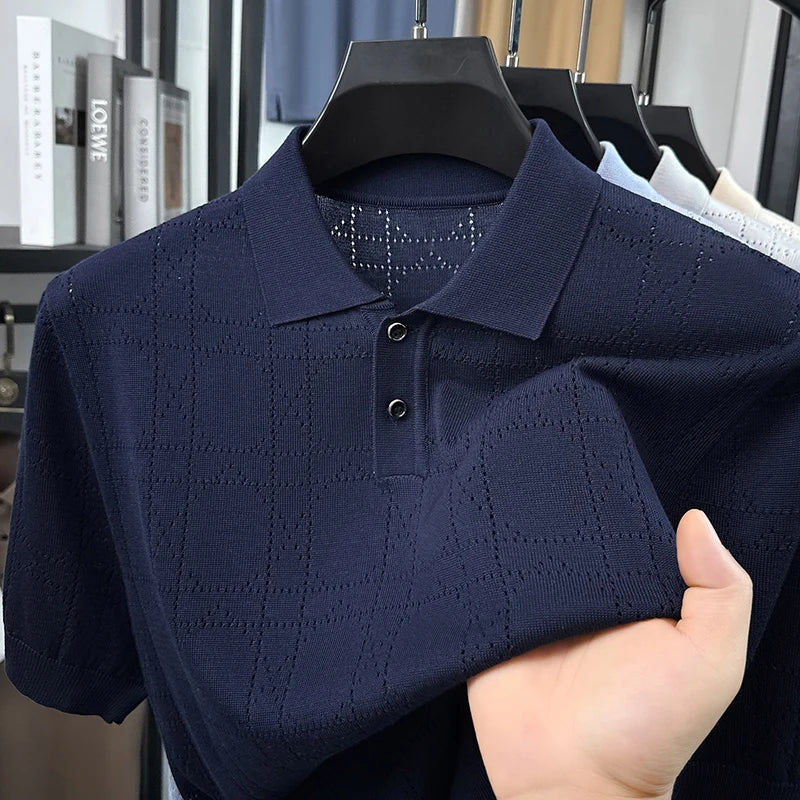 Navy open-knit polo on a hanger