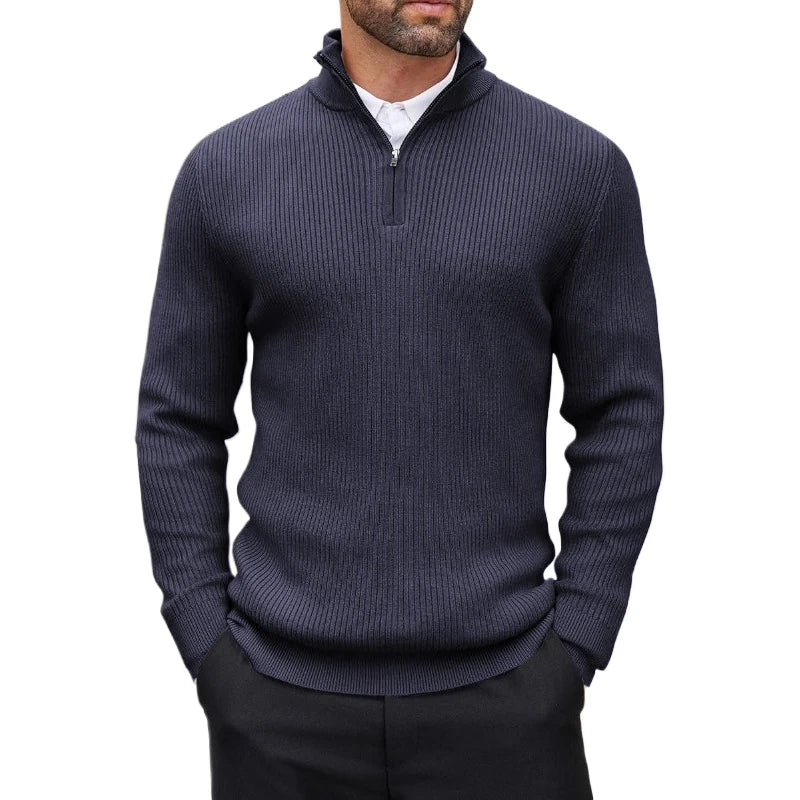 Man wearing a navy ribbed quarter-zip sweater