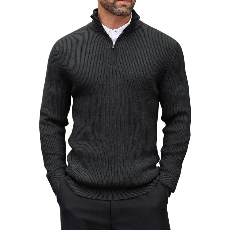 Man wearing a black ribbed quarter-zip sweater